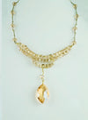 Rusted gold necklace with Horse Shoe Blue net beaded pedant